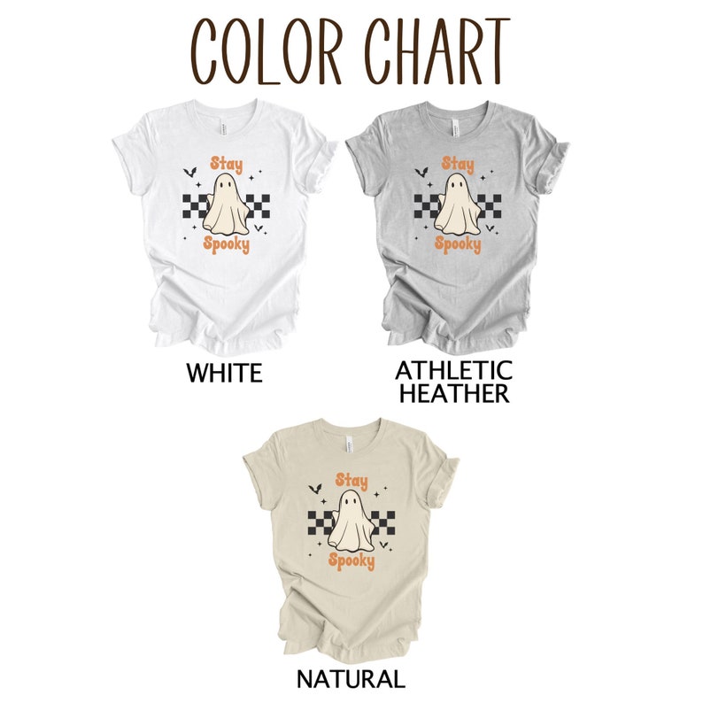 May include: Color chart of three t-shirts: white, athletic heather, and natural. Each shirt features a ghost graphic with the words "Stay Spooky" in orange. The ghost is centered on a black and white checkered pattern.