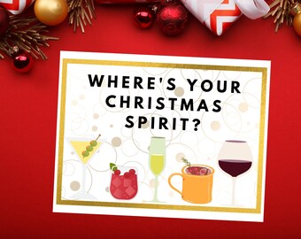 May include: A white card with a gold border and the text "Where's your Christmas spirit?"  The card features five different holiday drinks: a martini, a glass of white wine, a red wine glass, a mug of hot chocolate, and a glass of cranberry juice.
