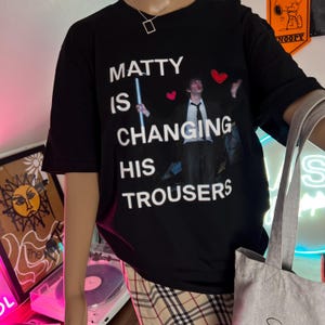 Matty is changing his trousers- 1975 inspired print T-shirt