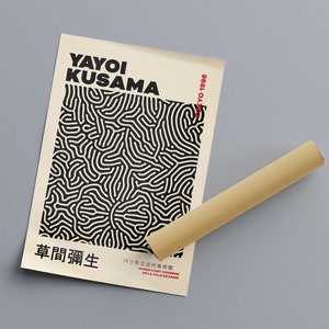 May include: A black and white poster with a geometric pattern and the text "YAYOI KUSAMA" and "草間彌生" in black. The text "TOKYO 1998" is in red in the upper right corner. The poster is rolled up and sitting on a brown cardboard tube.