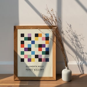 May include: A framed print of a colorful geometric abstract art piece by Ellsworth Kelly. The print is titled "Ferus Gallery" and includes the date "March 15, 1966".
