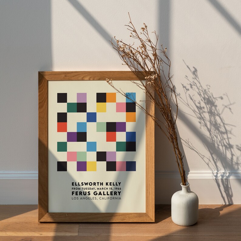 May include: A framed print of a colorful geometric abstract art piece by Ellsworth Kelly. The print is titled "Ferus Gallery" and includes the date "March 15, 1966".