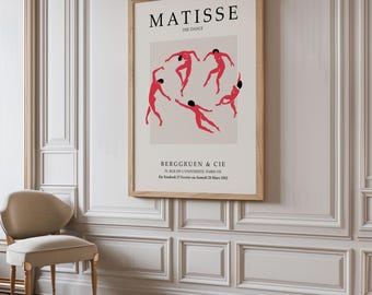 May include: A vintage poster for a Matisse exhibition featuring a red and black illustration of dancers in a circle. The poster is titled "The Dance" and includes the artist's name, Matisse, and the gallery name, "Berggruen & Cie".