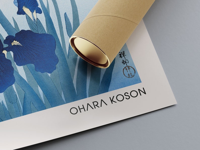 May include: A blue and white print of irises with a Japanese signature and the artist's name "Ohara Koson" printed below. The print is rolled up in a brown tube.