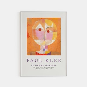 May include: A poster featuring an abstract painting by Paul Klee. The painting depicts a stylized human face with geometric shapes in shades of pink, yellow, orange, and red. The poster includes the text "Paul Klee", "Le Grand Galerie", "60 Rue de L'Universite", and "Mai a Juillet 1955".