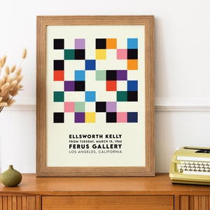 May include: A framed poster with a geometric design in shades of red, yellow, blue, green, black, and white. The poster is titled "ELLSWORTH KELLY" and includes the text "FROM TUESDAY, MARCH 15, 1966 FERUS GALLERY LOS ANGELES, CALIFORNIA".