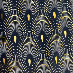 May include: A navy blue fabric with a repeating pattern of gold and white stylized sunbursts. The sunbursts are arranged in a wave-like pattern.