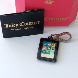 Juicy Couture Vintage C Tablet  charm. Rare and very collectable. Original Box and information sheet. Mint condition.