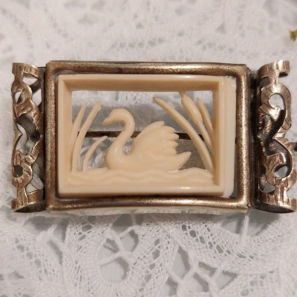 Rare Edwardian early celluloid carved swan brooch. With brass ornate frame, original trumpet closure. Unique and very collectable brooch.