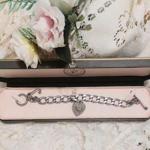 Juicy Couture silver linked charm bracelet with one detachable paved Heart Charm. Original and very collectable