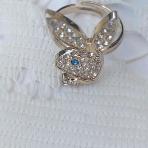 Playboy adjustable crystal ring. Excellent iconic ring. Stylish quirky and very collectable Bunny ring.