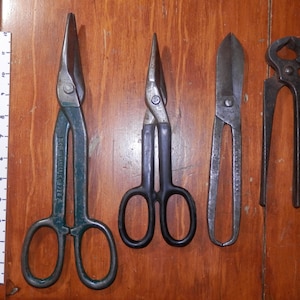 Collection of 3 antique bypass shears and one pair of nippers. Large, heavy duty tools. Cast iron or steel, one has plastic dipped handles.