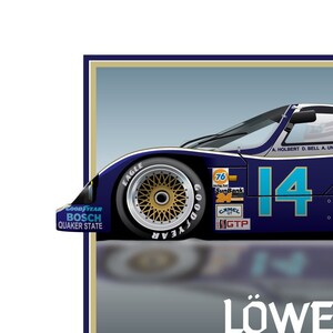 May include: A blue and white race car with the number 14 on the side. The car is a Porsche 962 and is sponsored by Löwenbräu Special. The car is on a gray background with the Löwenbräu logo and the words "Porsche 962" in white.