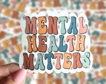 May include: A sticker with the words "MENTAL HEALTH MATTERS" in a retro font. The sticker has a scalloped edge and features a color palette of orange, pink, blue, and brown. The background is a pattern of the same text.