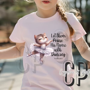 May include: A pink t-shirt with a cute cartoon ballerina cat wearing a white tutu. The shirt has the text "Let them Praise His Name with Dancing" and "Psalm 149:3" printed on it.