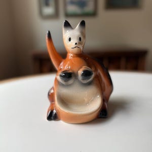 May include: A rustic wooden sign with the text "Welcome to our home" in white lettering. The sign features a distressed finish and a simple, inviting design, perfect for entryway decor.