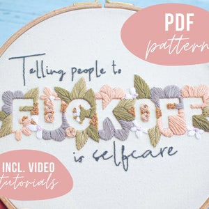 May include: Embroidered hoop art featuring the phrase "Telling people to F*CK OFF is selfcare" in colourful floral lettering. The hoop is surrounded by a pink circle with the text "PDF pattern" and a pink rectangle with the text "INCL. VIDEO tutorials".