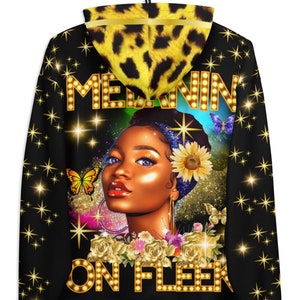 May include: Black hoodie with a gold and black design featuring a woman with a sunflower and the text "Melanin on Fleek". The hoodie has a leopard print hood lining.