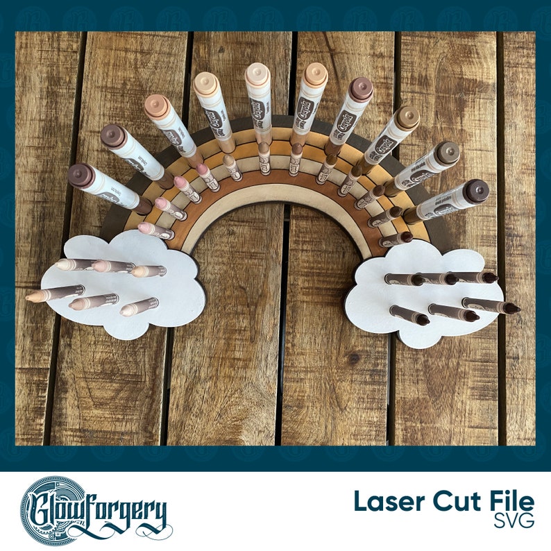 May include: A wooden rainbow-shaped organiser with two cloud-shaped compartments, designed to hold and display markers or crayons. The organiser is made of natural wood and has a rustic, farmhouse style.