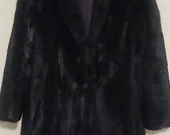 Stunning, mink fur by Koslow's. Glossy and a stand out, beautiful, black with mahogany undertones. Size: Stadium length for petit person.