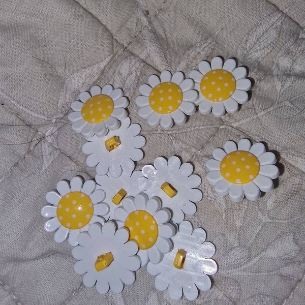 Daisy's on yellow buttons.  20mm. Buy as many as you need.