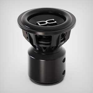May include: A black subwoofer with a circular design. The top features a black surface with the white letters "DC". The subwoofer has a cylindrical base with two circular openings.