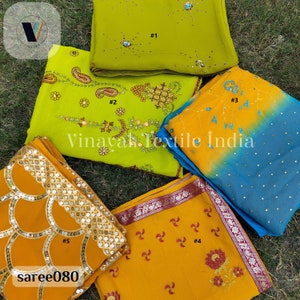 Peut inclure: Cinq morceaux de tissu jaune et vert différents avec des broderies et des paillettes. Le tissu est numéroté de 1 à 5. Le texte "Vinayak Textile India" est visible au centre de l'image.