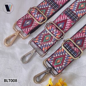 May include: Three colorful embroidered bag straps with geometric patterns in shades of pink, blue, orange, and green. Each strap has a metal clasp and adjustable hardware. The straps are labeled BLT008.