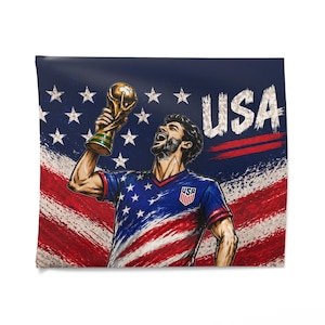 May include: Illustration of a soccer player holding a gold trophy, celebrating against a backdrop of the American flag. The player wears a blue jersey with the USA logo. The word "USA" is prominently displayed.