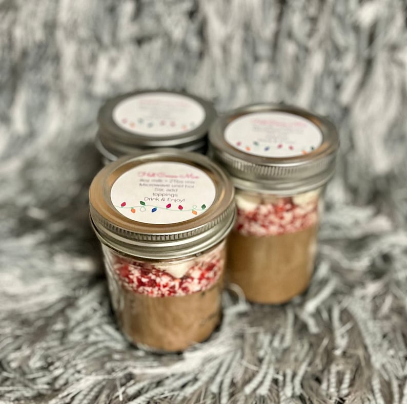 8 oz Mason Jars filled with hot cocoa mix, peppermint and marshmallows!
