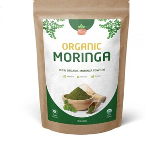 May include: A brown paper bag with a white label that reads "ORGANIC MORINGA 100% ORGANIC MORINGA POWDER". The label also features a green leaf design and a small green circle with the text "USDA Organic". The bag contains 16 ounces (454 grams) of organic moringa powder.