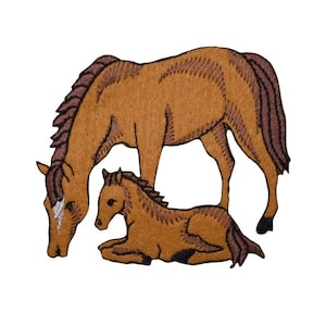 May include: An embroidered patch of a brown horse with a brown foal lying down. The horse is looking down at the foal.