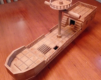 May include: A light brown wooden model ship featuring a central mast with a circular crow's nest, a tiled deck surface, railings along the sides, a raised stern section with stairs leading to a doorway, and a grid-patterned floor design.