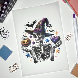 May include: A skeleton wearing a purple and black witch hat with a star and heart design. The skeleton is holding a jack-o-lantern and has a spooky expression.