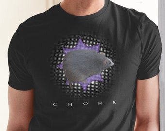 May include: A black t-shirt with a purple and white graphic of a large gray rodent with the word "CHONK" printed below the graphic.