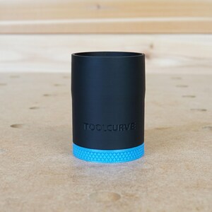 May include: A black tool holder with a blue base and the text "TOOLCURVE" printed on the side.