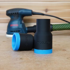 Peut inclure: Deux adaptateurs de collecteur de poussi&egrave;re noirs avec une garniture bleue. Les adaptateurs sont &eacute;tiquet&eacute;s "TOOLCURVE".
