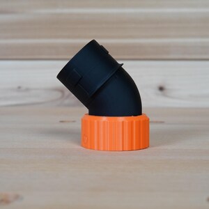 May include: Black plastic 90-degree elbow pipe fitting with an orange threaded connector.