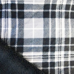 May include: Black and white plaid fabric with a soft black fleece backing.