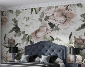 May include: A bedroom with a blue upholstered bed with a floral patterned wallpaper. The bed has a headboard with tufted buttons and a matching footboard. There are two nightstands with lamps on either side of the bed. A blue ottoman sits in front of the bed.