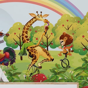 May include: A colorful illustration of animals riding unicycles in a whimsical forest setting. A giraffe with a green scarf rides a unicycle, a lion rides a unicycle, a hippo plays the violin, and two chickens sit at a table.