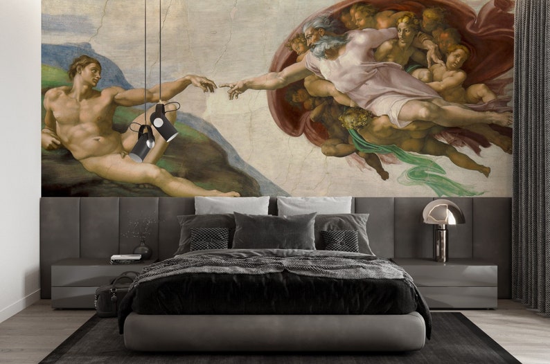 May include: A black and gray bed frame with a gray headboard and a black and white patterned comforter. The headboard features a mural of Michelangelo's The Creation of Adam, a famous Renaissance painting depicting God reaching out to Adam.
