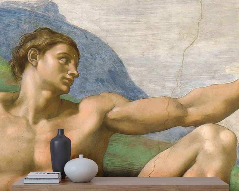 May include: A close-up of a painting depicting a muscular man with his arm outstretched. The man is nude and has a light brown complexion. The background is a light blue sky with a large, rocky mountain in the distance.