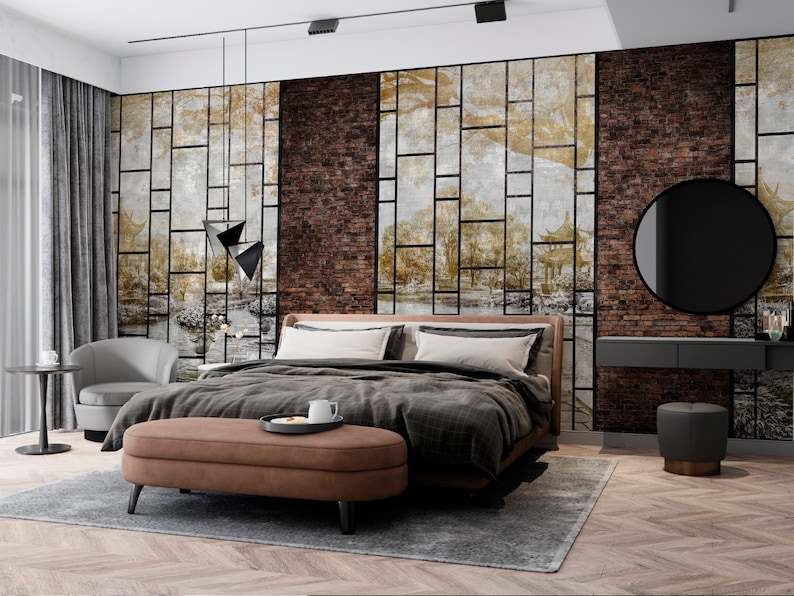Może przedstawiać: Sypialnia z dużym ł&oacute;żkiem, brązowym sk&oacute;rzanym pufem, szarym fotelem, czarno-szarym stolikiem nocnym, czarnym okrągłym lustrem i czarno-szarym toaletką z dwoma szufladami. Ściany są ozdobione tapetą z wzorem ceglanym i geometrycznym.