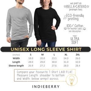 May include: Unisex long sleeve t-shirt size chart in inches. The chart shows the width, length, and sleeve length for sizes S, M, L, XL, and 2XL. The text "Compare your favourite T-Shirt LAID FLAT. Measure Length: shoulder to bottom and Width: below armpit across." is below the chart. The text "INDIEBERRY" is at the bottom of the chart.