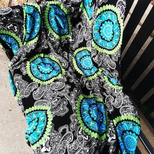 1980s Vintage printed polyester knit crepe 60” wide, 2.5 yards long Black background white paisley with large blue & green medallions