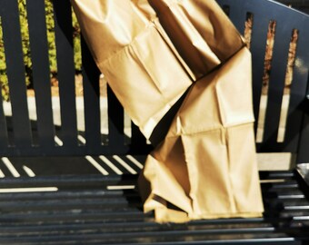 1980’s cotton/poly blend with a surface coating in brown, 29” wide x 1.8m long.