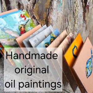 May include: A collection of handmade original oil paintings, each with unique colorful designs. The paintings feature various subjects, including a hummingbird, fish, and abstract art. The text "Handmade original oil paintings" is overlaid on the image.