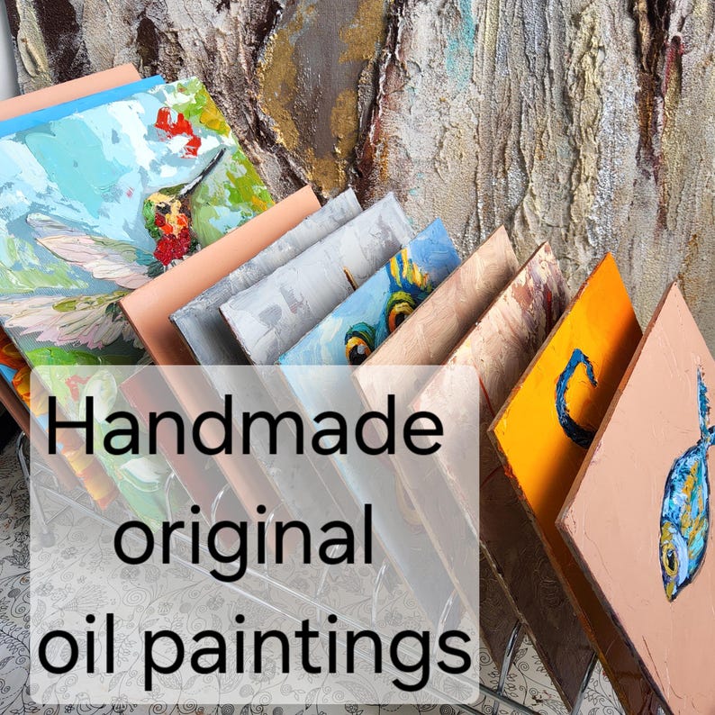 May include: A collection of handmade original oil paintings, each with unique colorful designs. The paintings feature various subjects, including a hummingbird, fish, and abstract art. The text "Handmade original oil paintings" is overlaid on the image.