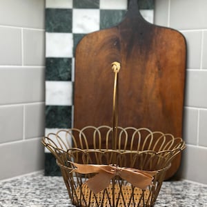 Vintage Gold Tone Metal Basket With Wicker Weave Bottom Wrapped Around Satin Bow